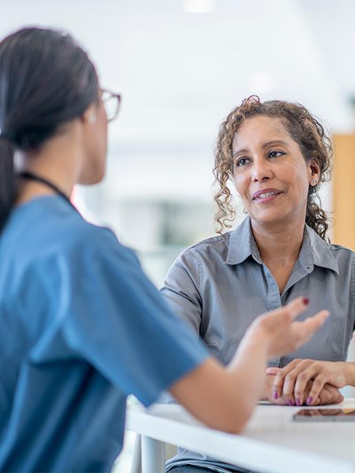 Patient speaking with a healthcare professional during a consultation.